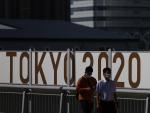 Gente con mascarillas en Tokio, donde se celebran los Juegos Olímpicos.