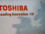 A Toshiba logo is seen during a press conference a