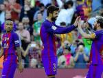 Piqué y Messi celebran un gol del Barcelona.
