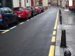La Gerencia de Urbanismo repavimenta la calzada de la céntrica calle Trajano de Sevilla