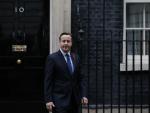 British Prime Minister David Cameron steps out of