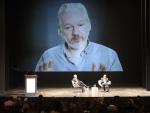 Wikileaks founder Julian Assange (on then screen)