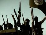 Imagen de varios combatientes con una bandera de Estado Islámico /AFP