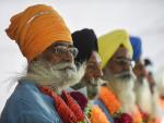 TOPSHOTSKarnal Singh, 73, (L) sits with other Indi