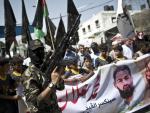 An Islamic Jihad fighter leads a march organized b