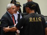 Guatemalan ex-President Otto Perez (L) is taken aw