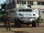 Burkina Faso army troops stand guard outside Guill