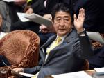 Japanese Prime Minister Shinzo Abe takes part a bu