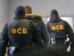 Imagen de archivo de agentes del FSB durante el traslado de un detenido (NTV.ru)