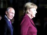 Vladimir Putin y Angela Merkel