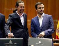 Pablo Iglesias y Alberto Garzón, en la recogida de sus carteras ministeriales