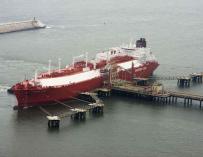 LNG tanker unloading gas in a port.