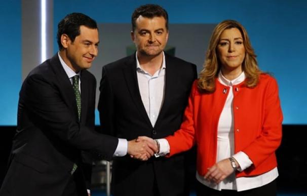 Andalusia's regional government president and Socialist Party (PSOE) candidate, Diaz, and opposition Popular Party leader (PP), Moreno Bonilla, shake hands next to opposition United Left leader (IU) Maillo pose for pictures before a televised election deba