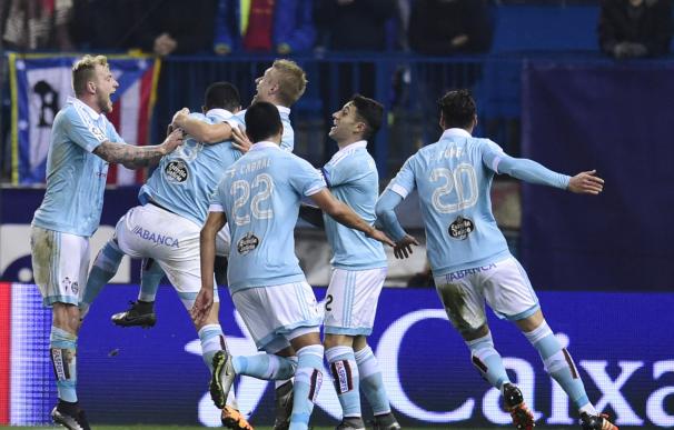 Celta Vigo players celebrate after scoring ther th