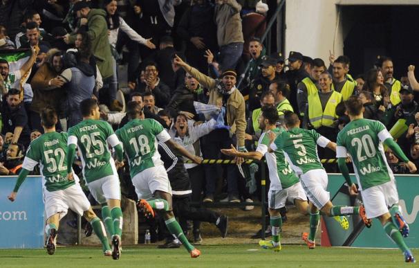 Betis' defender Alvaro Cejudo (C) celebrates after