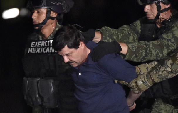 Drug kingpin Joaquin "El Chapo" Guzman is escorted