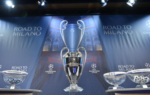 The UEFA Champions league trophy is displayed ahea