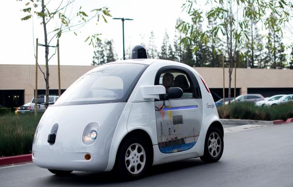 A self-driving car traverses a parking lot at Goog