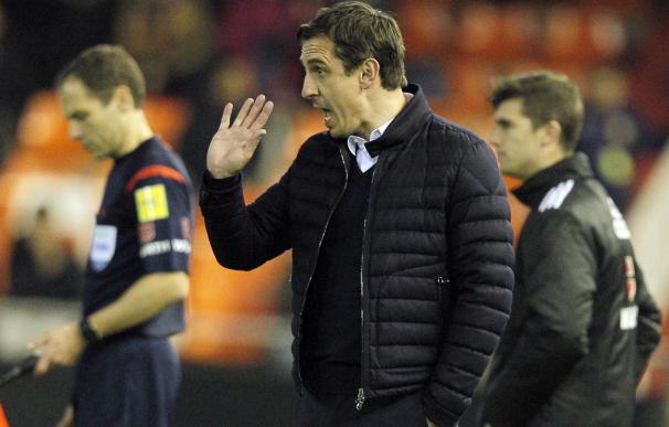 Valencia's British coach Gary Neville gestures on