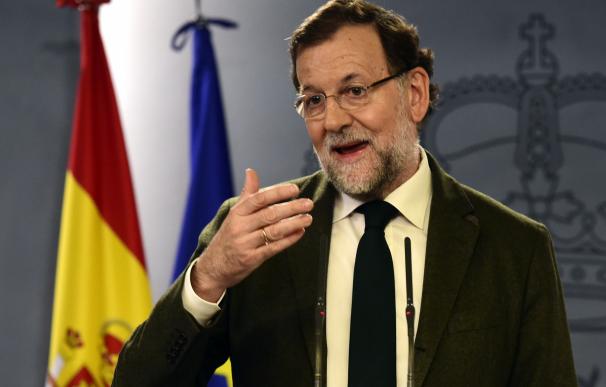 Spanish Prime Minister Mariano Rajoy holds a press