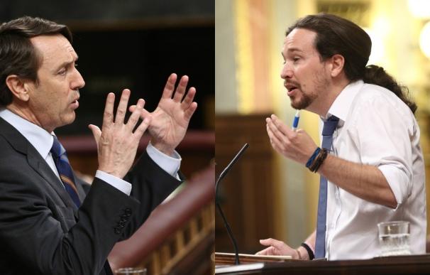 Moción (y 29)- Iglesias acusa al PP de no ser "honrados" y Hernando dice que no puede dar lecciones tras poner "el cazo"