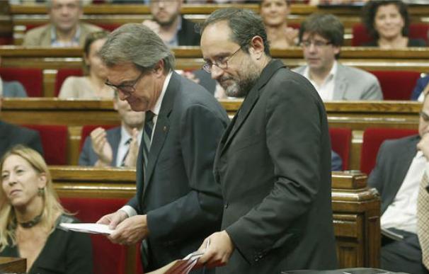 Artur Mas y Antonio Baños, de la CUP, en el debate de investidura, en noviembre.