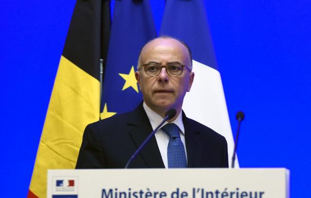 French interior minister Bernard Cazeneuve looks o