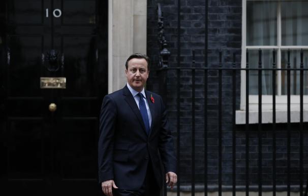 British Prime Minister David Cameron steps out of