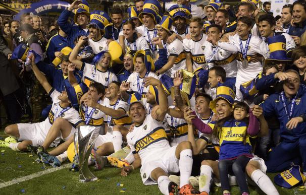 Boca Juniors' footballers pose for pictures after