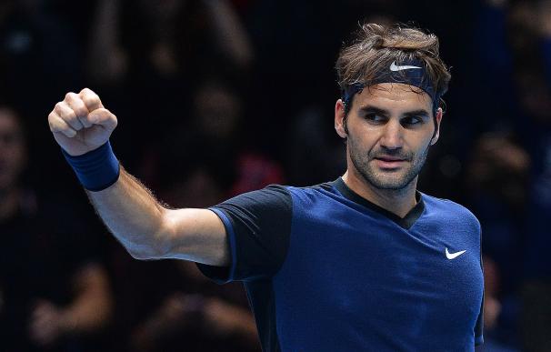 Switzerland's Roger Federer reacts after beating J