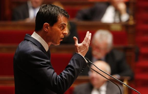French Prime Minister Manuel Valls gestures as he