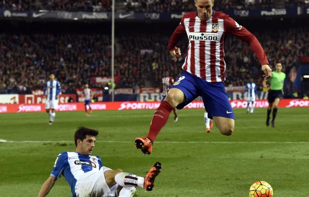 Atletico Madrid's forward Fernando Torres jumps ov