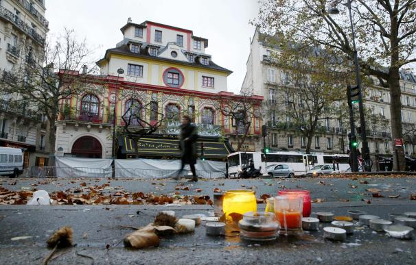 A woman walks past the Bataclan Theater in Paris o