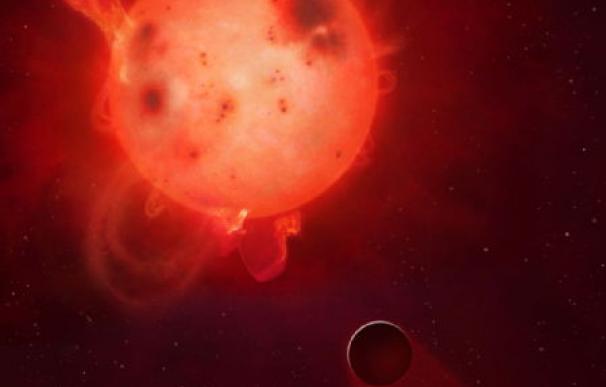 Recreación del aspecto que tendría Kepler-438b frente a su estrella, una peligrosa enana roja.
