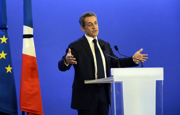 Former French President Nicolas Sarkozy deliver an
