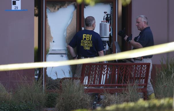 SAN BERNARDINO, CA - DECEMBER 07: FBI agents work