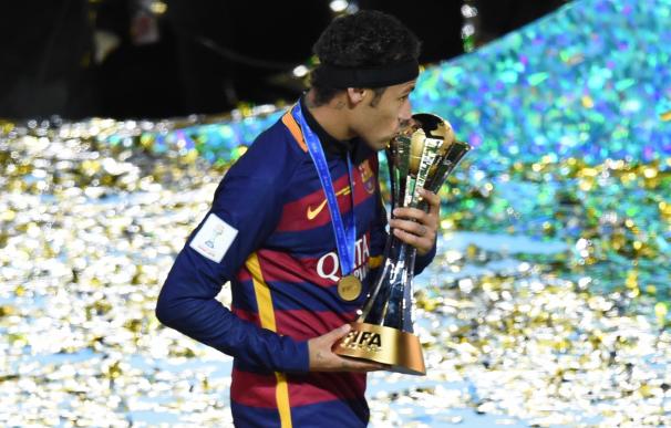 Barcelona forward Neymar celebrates with the troph