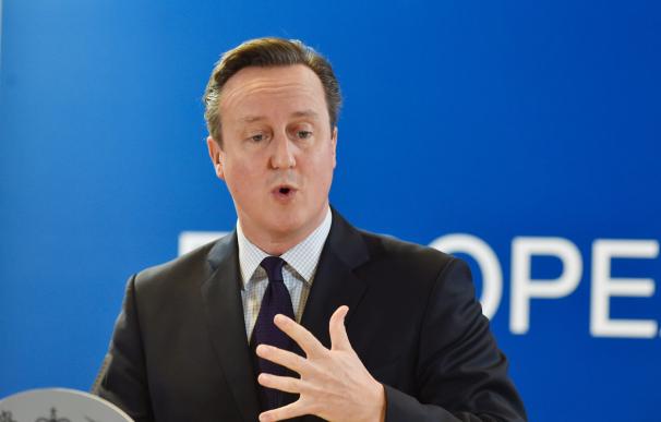 British Prime Minister David Cameron holds a press