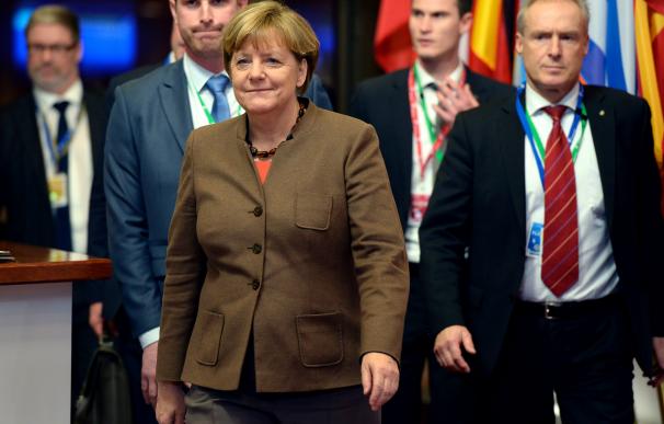 German Chancellor Angela Merkel leaves at the end