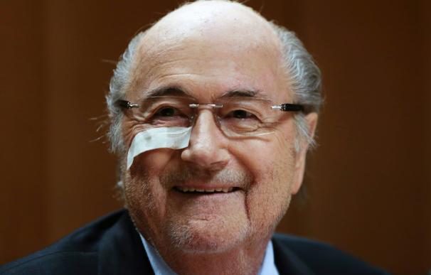 Suspended FIFA president Sepp Blatter looks on dur