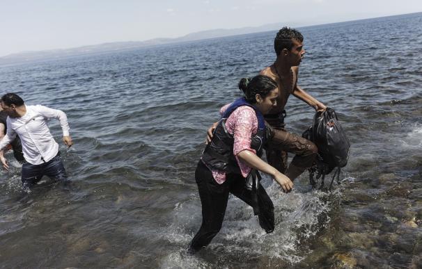 Migrants arrive on the Greek island of Lesbos afte