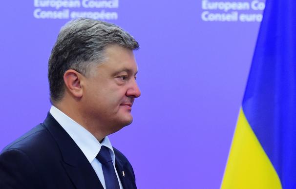 Ukraine's President Petro Poroshenko looks on at t