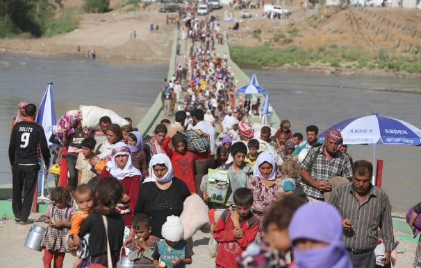 Miles de iraquíes huyen del avance del 'EI' en agosto de 2014