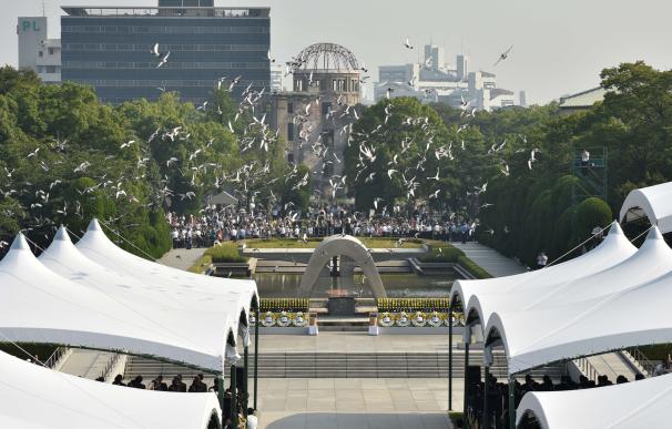 Doves fly over the Hiroshima Peace Memorial Park i