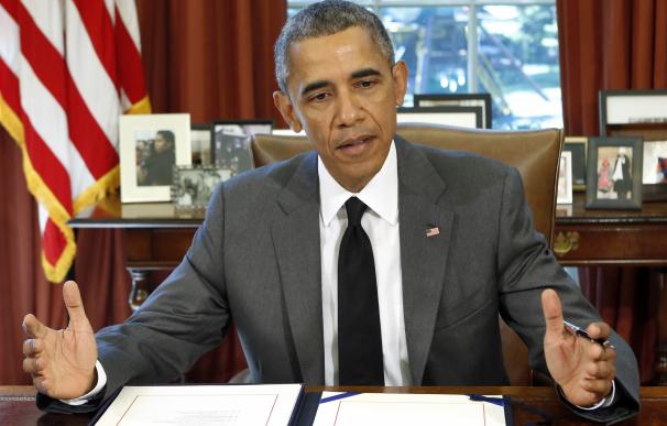 US President Barack Obama gestures as he talks to