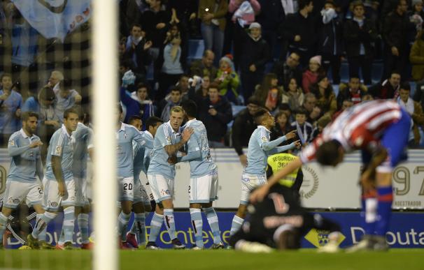 Celta players celebrate after scoring the opening