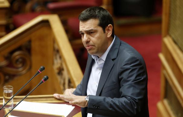 Greek Prime Minister Alexis Tsipras gestures as he