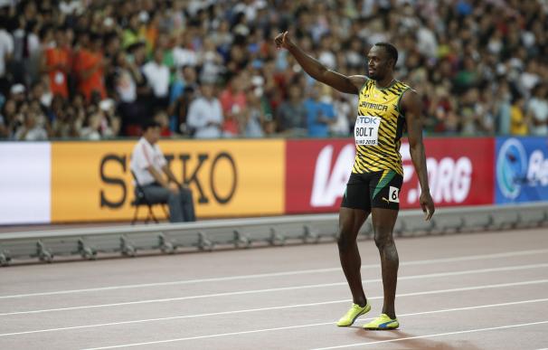 Jamaica's Usain Bolt reacts after a heat of the me