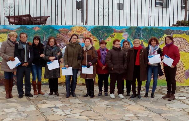 Diputación embellece las calles de Alcudia de Monteagud con un mural sobre las tradiciones agrícolas
