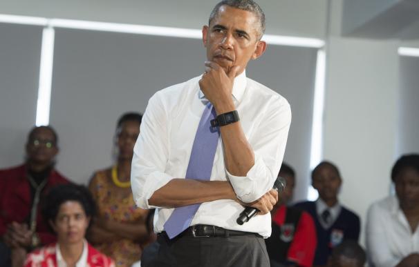 US President Barack Obama listens during an event